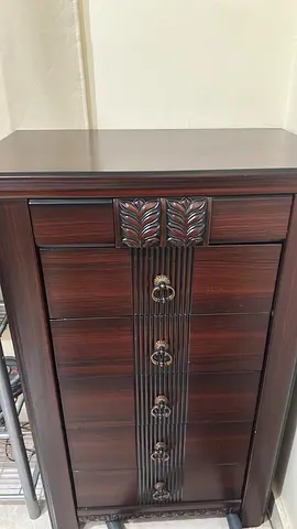 Classic Dark Wood Dresser with Carved Details