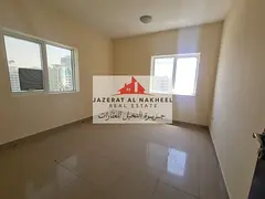 wo-bedroom apartment with a living room for rent in Al-Taawun, with free air conditioning, gym, and
