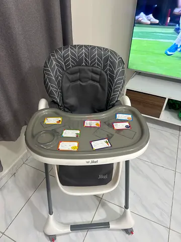 Used Jikel adjustable baby high chair with tray