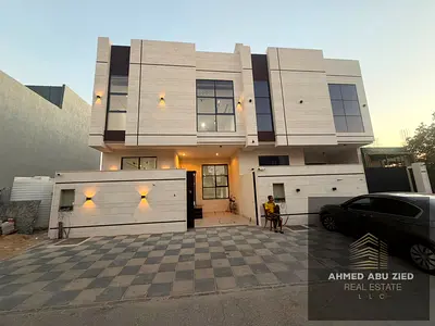 For sale in Al Yasmin, Ajman, a townhouse consisting of 4 bedrooms, a majlis, a living room, a kitchen, a maid's room, ground floor, first floor, and