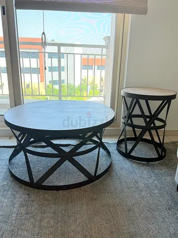 Home center Set of 2 matching round coffee table and end table.
