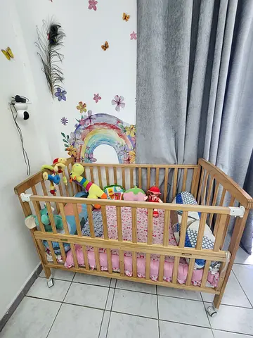 Moon wooden portable crib with 3 level height adjustment and folding rail- natural wood