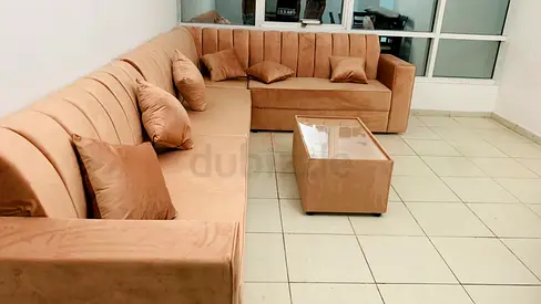 L-shaped velvet sofa set with matching ottoman - good condition