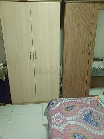 Bed, side tables and cupboards