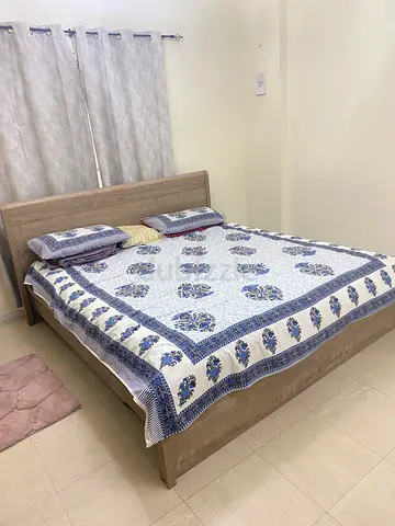 Wooden kingsized bed frame without mattress