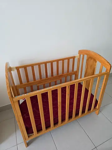 Solid wood baby crib with mattress - good condition