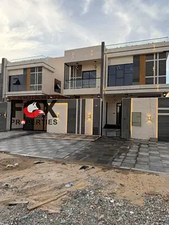 Luxury villa for sale in Al Rawda, Ajman. 5 BR, 5000 sq.ft., majlis, 2 halls, maid room, outdoor kit