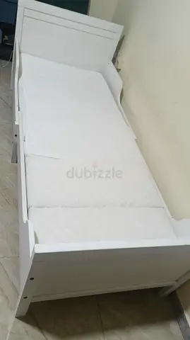 Ikea Extendable kids bed for sale ...white wooden bed frame with mattress (good condition)