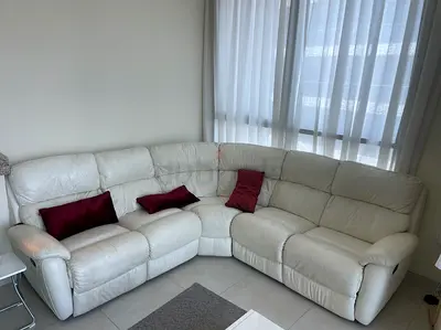 Large leather L-shaped corner sofa - comfortable, good condition. Possible to recline on both sides