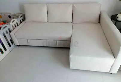 Light beige L-shaped sofa with storage, good condition