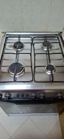 Used 4-Burner Stainless Steel Gas Cooker with Oven - Good Working Condition