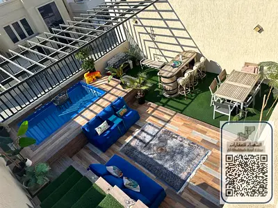 A villa with 5 master bedrooms, a living room, a majlis, 2 kitchens, a swimming pool, and a terrace, with a modern design, located in Al Zahia, Ajman,