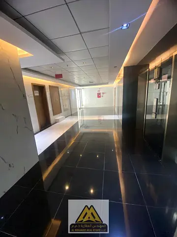 The apartment features a master bedroom with built-in wardrobes, balcony, two bathrooms, central AC, and free maintenance by the landlord, offering co