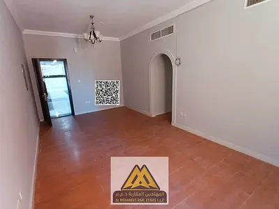 One-bedroom apartment for annual rent in Al Muwaihat 1, Ajman. Features a master bedroom, two bathrooms, parquet flooring, and high-end finishes.