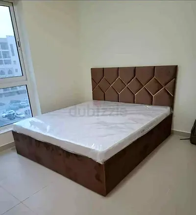 Brown upholstered king size bed with storage,