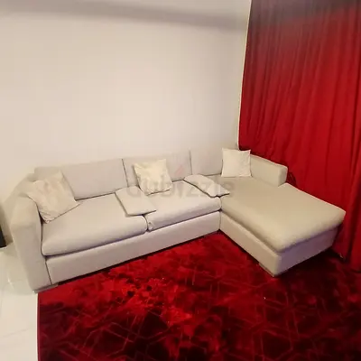 Light grey L-shaped corner sofa with chaise, good condition