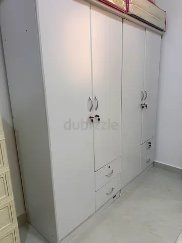 2 separate White 2-Door Wardrobe with Shelves and Drawers
