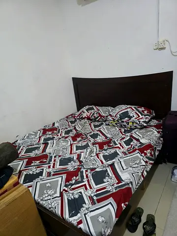Double bed with wooden headboard — good condition