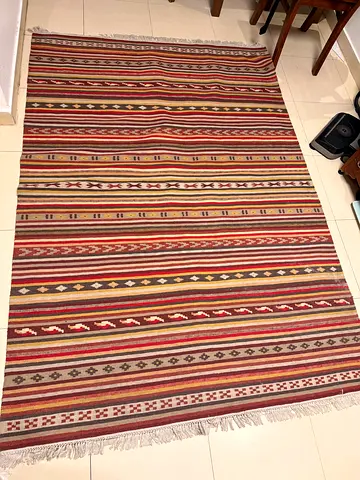 Handwoven striped kilim-style rug - good condition