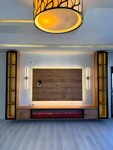 Modern built-in entertainment unit with LED lighting and electric fireplace