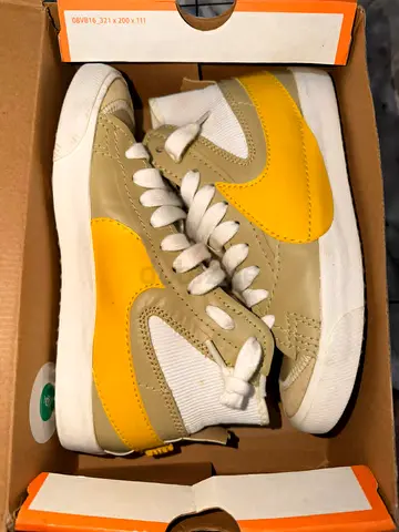 Used Nike-style yellow  beige casual sneakers, size not specified