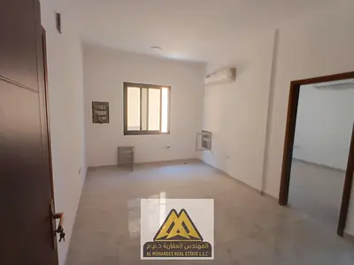 First-occupant one-bedroom apartment with living room in Al Alia, Ajman. Split AC, family building, prime location close to services. AED 29,000 in 4