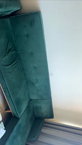 Used green velvet L-shaped corner sofa - good condition