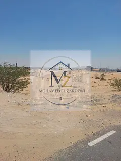 Commercial corner plot for sale in Al-Hawshi, measuring 12,000