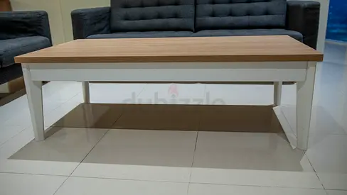 Wooden Coffee Table with White Base and Lower Shelf - Good Condition