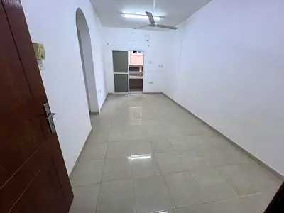 One bedroom, living room, bathroom, and two balconies. No air conditioning. Free maintenance. Ajman Corniche.