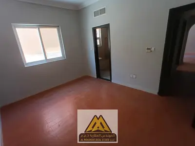 1-bedroom apartment in Al Mowaihat 1, ground floor, 2 bathrooms, parquet flooring. AED 27K yearly, 4 payments, free maintenance, prime location near s
