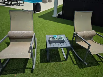Outdoor rocking lounge chairs with side table - set of 2