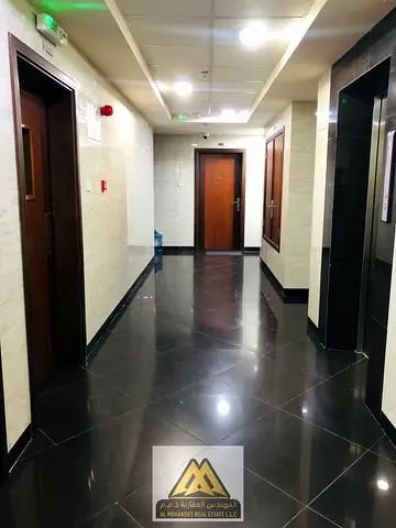 Two-bedroom apartment with separate living room and master bedrooms for annual rent in Al Jurf 2, Ajman, near the university.