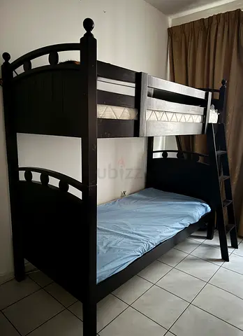 Solid wood dark bunk bed with ladder - good condition