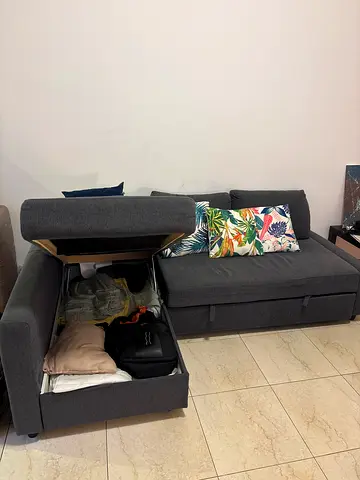 Dark grey L-shaped sofa with chaise