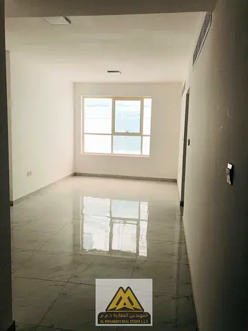 2-bedroom apartment with living room in Al Helio 2, Ajman, central AC, 2 bathrooms, built-in wardrobes, large space, near KFC, AED 35,000 in 6 install