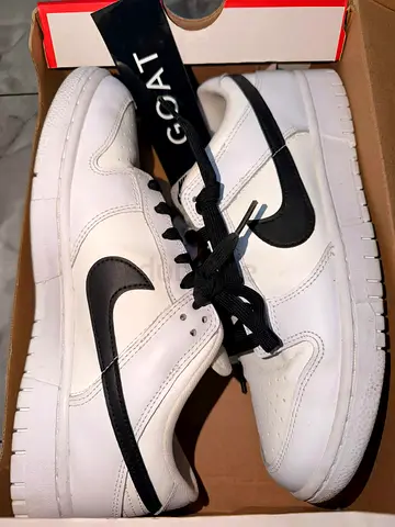 White leather sneakers with black swoosh — lightly used