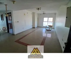 For rent: 2-bedroom apartment with hall in Al Rashidiya 3. 2 bathrooms, balcony, parking, wardrobes,