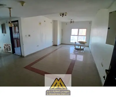 For rent: 2-bedroom apartment with hall in Al Rashidiya 3. 2 bathrooms, balcony, parking, wardrobes, laundry room, close to Corniche. AED 46,000 in 4