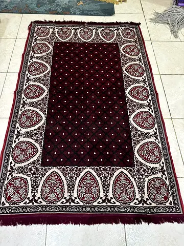 Used maroon Persian-style area rug - 5x8 (approx), good condition
