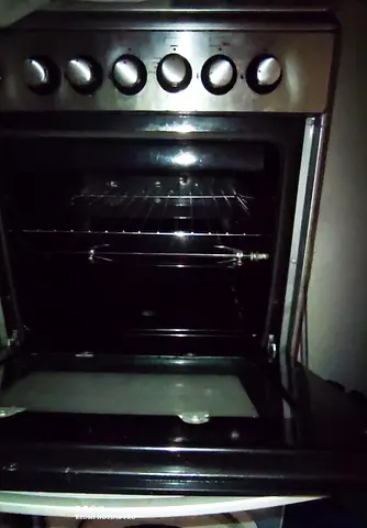 Used freestanding gas oven and stove - stainless steel front