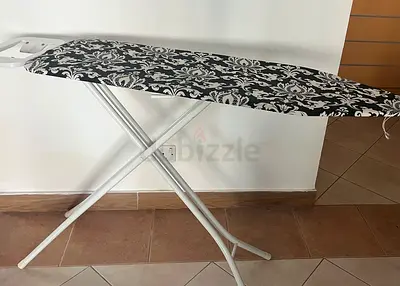 Ironing board with patterned cover - good condition