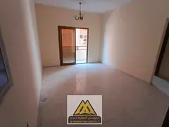 The apartment features 2 bathrooms and a spacious balcony, located in a prime area next to Al Hikma