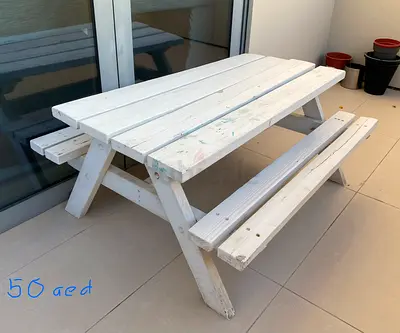 Wooden picnic table with bench
