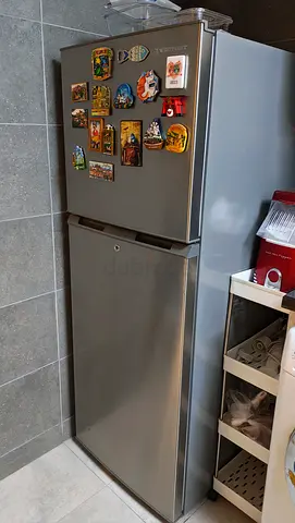 Silver two-door refrigerator (top freezer) in excellent condition
