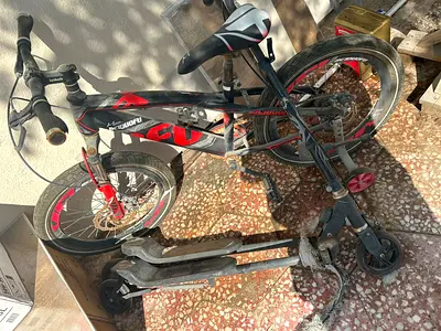 Used kids bike with training wheels and cooter -