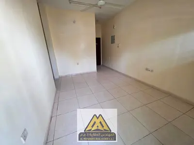 1 Bedroom Hall in Al Nuaimiya 2, ground floor with balcony, 2 bathrooms, prime location near all services, AED 24,000 yearly, 4 payments.
