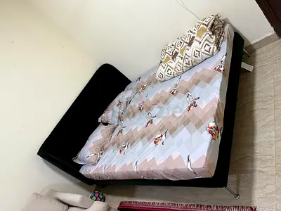 Green upholstered double bed with headboard - good condition