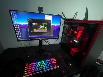 Gaming PC setup with monitor, RGB keyboard and webcam - ready to play