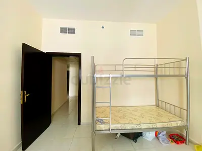 Spacious Bed Space for Rent in Al Nadha - Walking Distance to Stadium Metro!